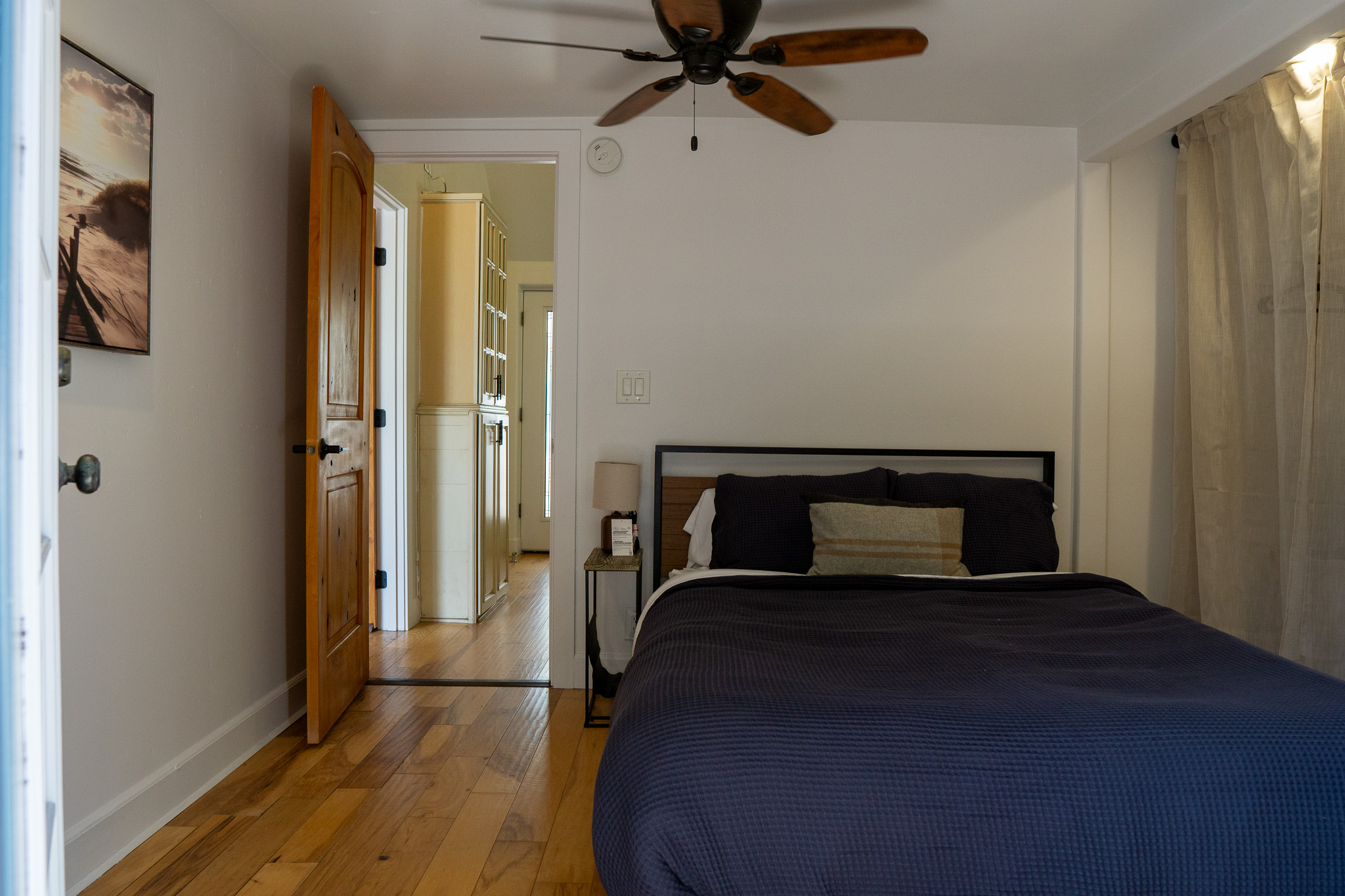 Bright and calming bedroom space with natural lighting, soft linens, and a peaceful ambiance.