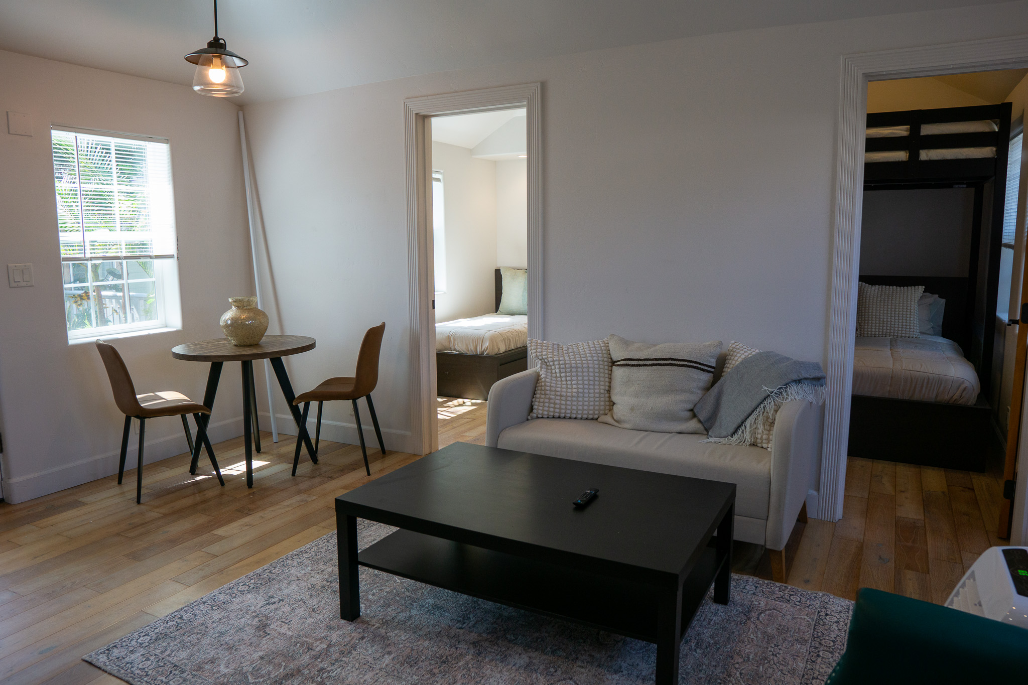 Tranquil sober living bedroom featuring soft lighting, neutral tones, and recovery-focused design.