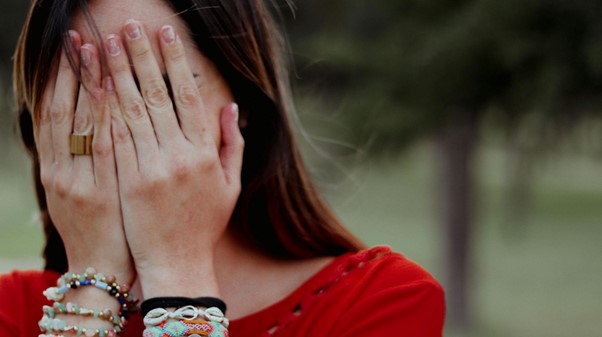 woman covering face